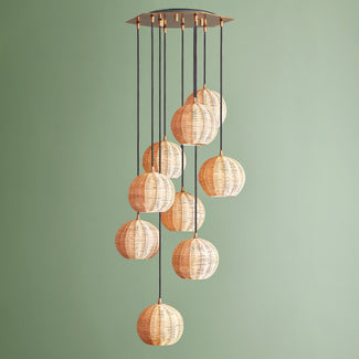 Solaris chandelier in brass and rattan