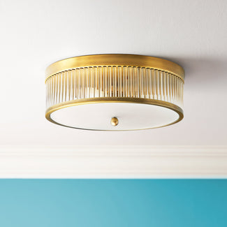 Round Roddy IP44 flush ceiling light in antique brass and clear glass