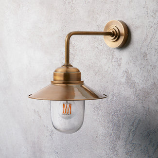 Plover IP44 wall light in antique brass